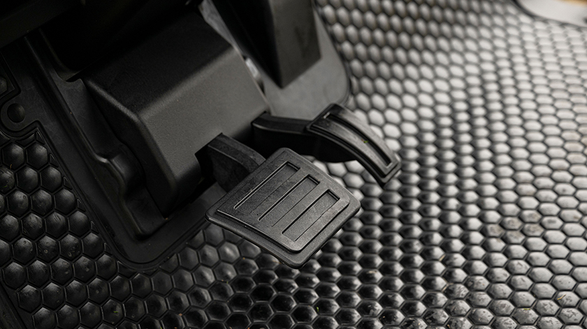 Hanging brake and gas pedals of an E-Z-GO.