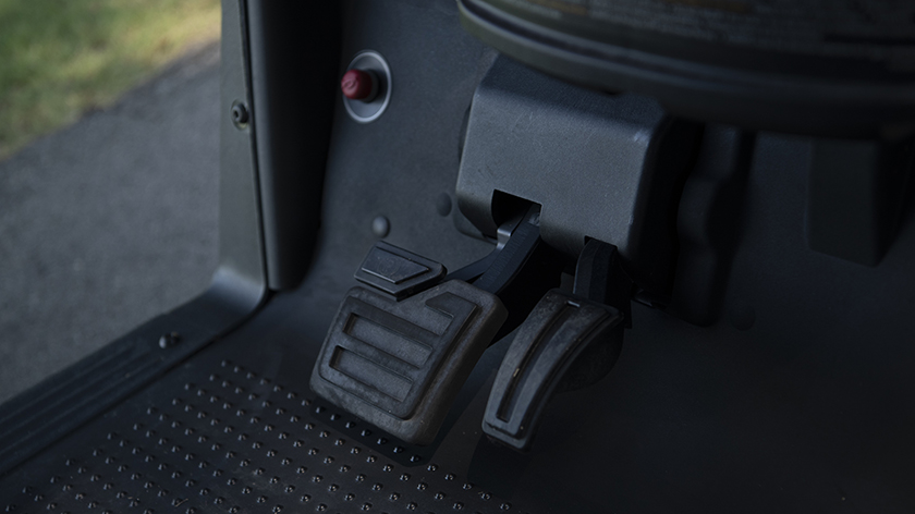 The hanging brake and gas pedals of the E-Z-GO Freedom RXV.