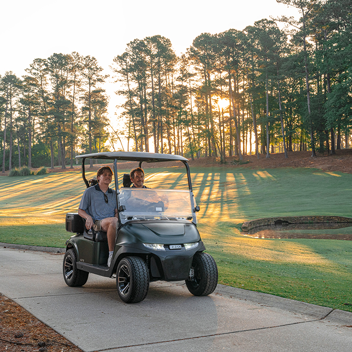 RXV 2 driving on a cart path on a golf course