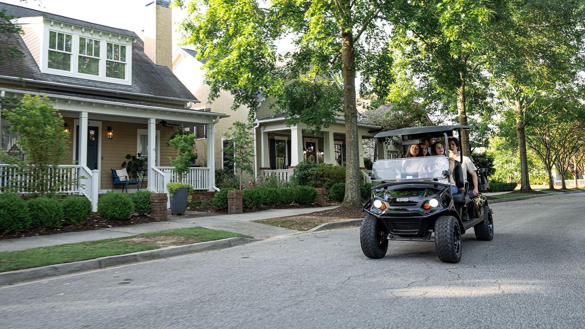 Express 6 riding through a neighborhood with a family of 5