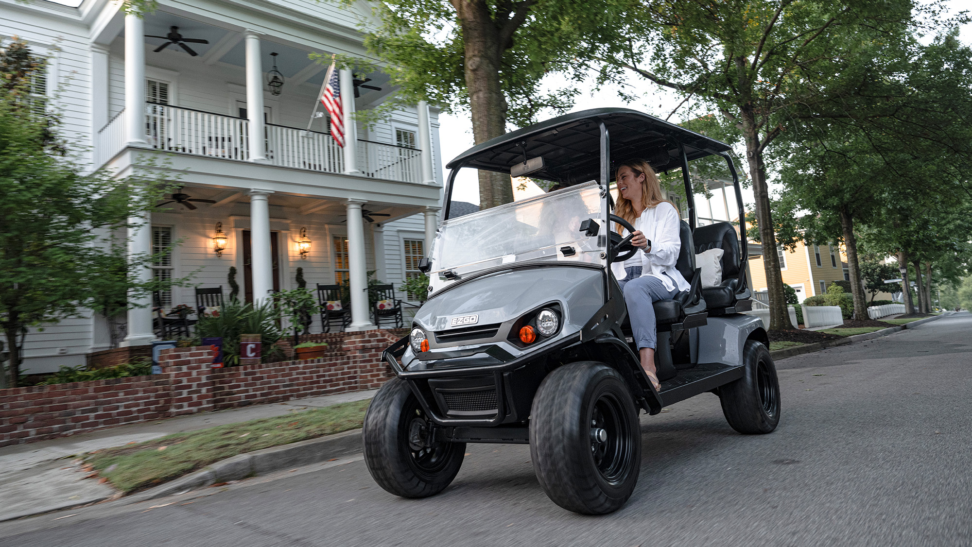 Liberty riding through a neighborhood