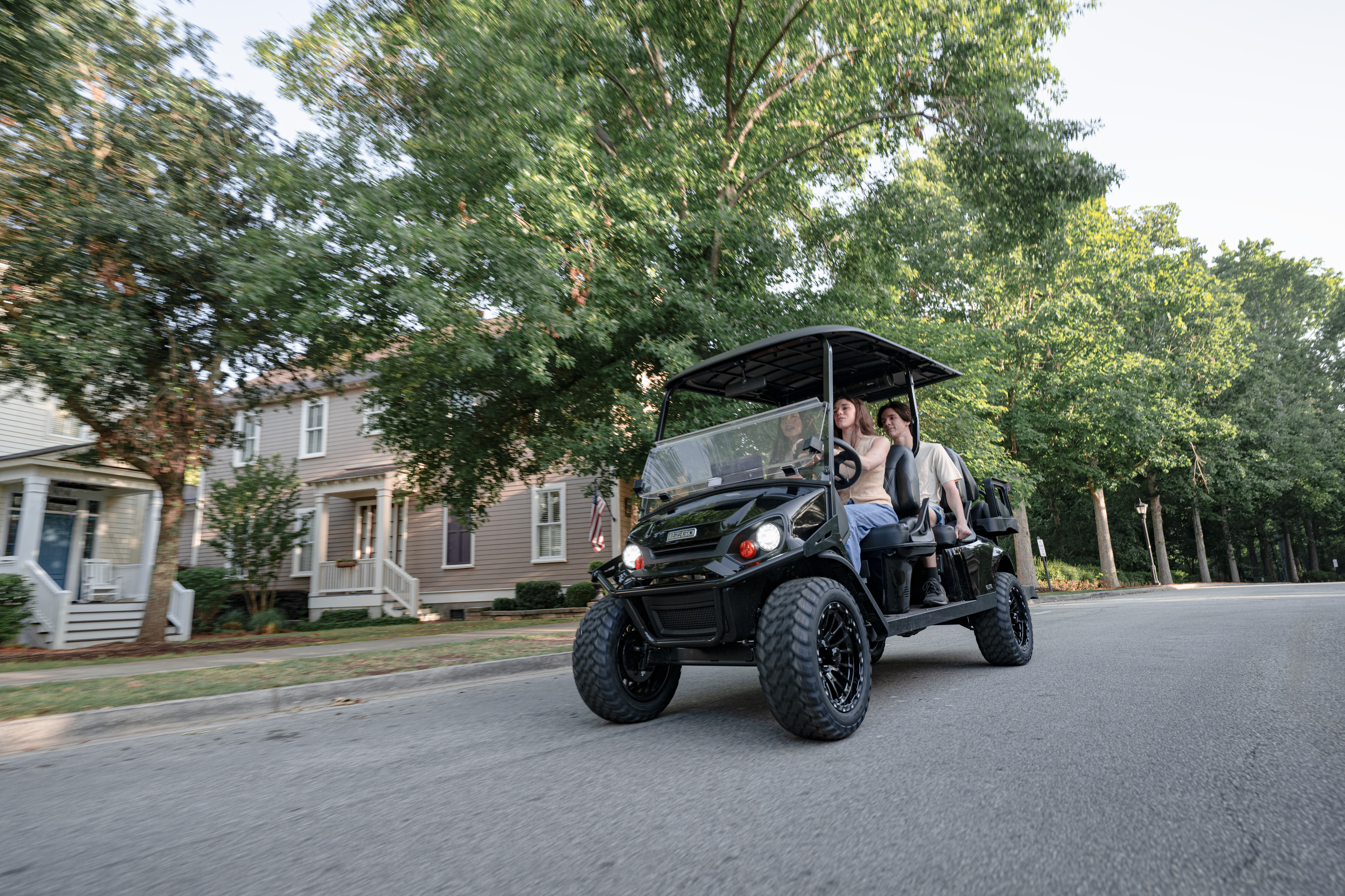 Express 6 with a family of 5 driving in a neighborhood 