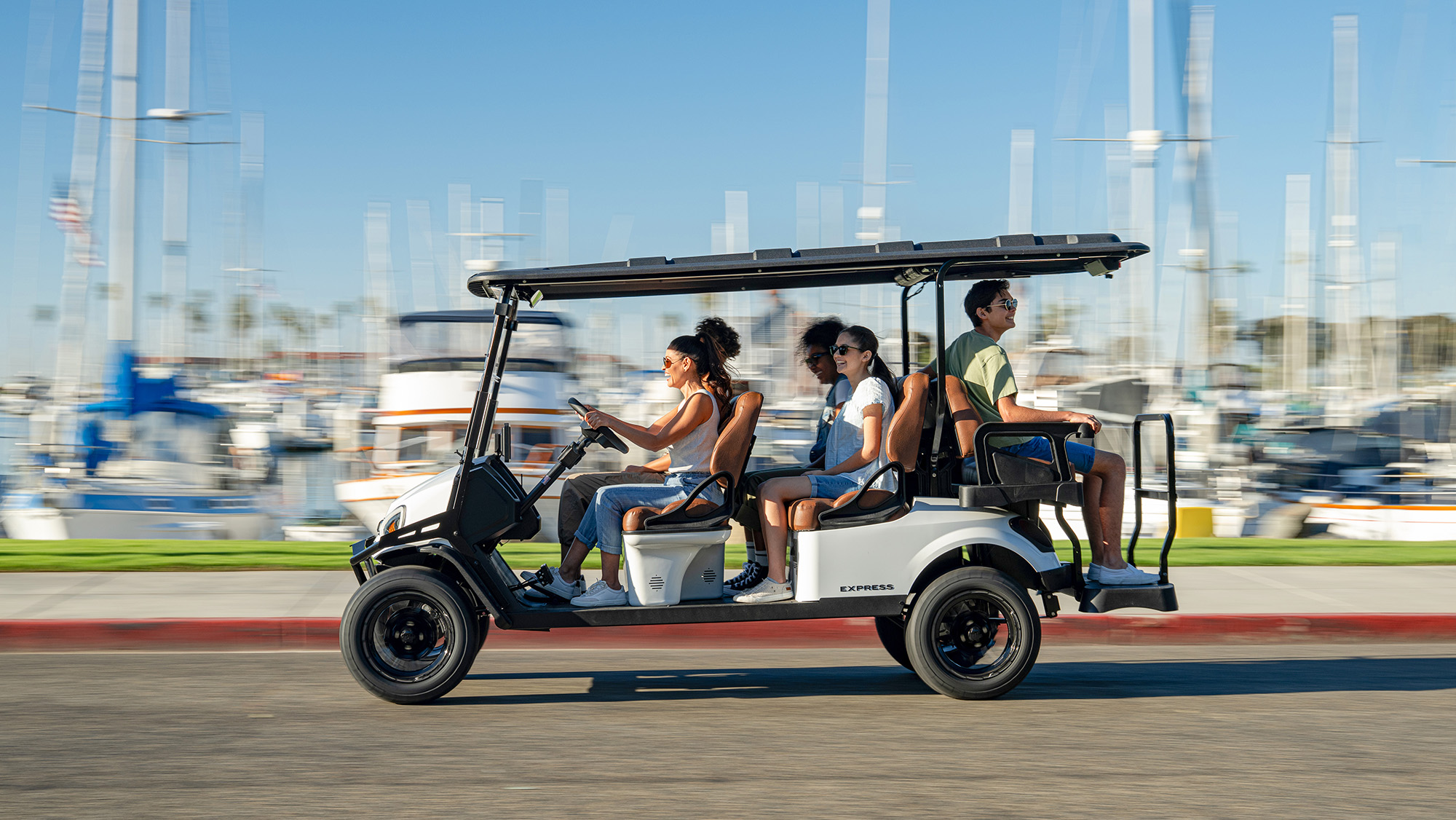 Express 6 driving past a marina/harbor