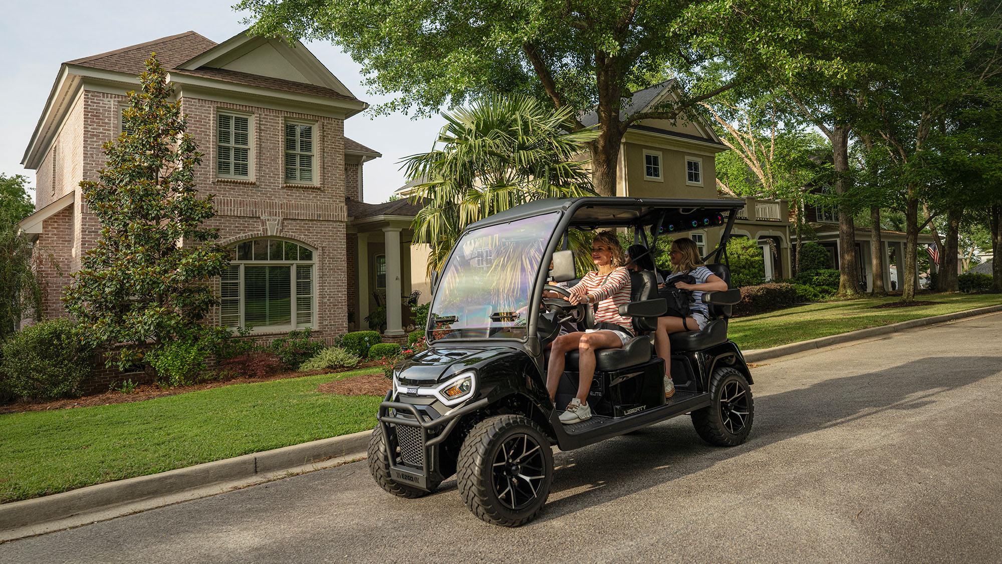 E-Z-GO Liberty 4F electric golf cart with four forward-facing seats