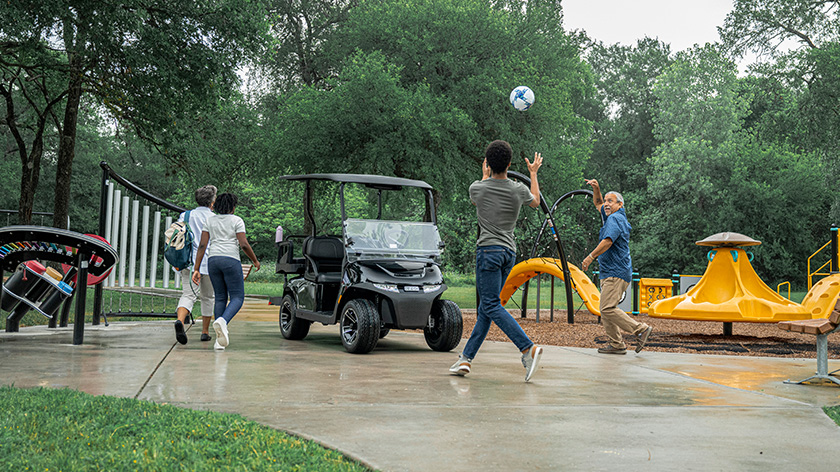 E-Z-GO RXV 4 electric and gas vehicle with two forward and two backward seats with a standard ride height 