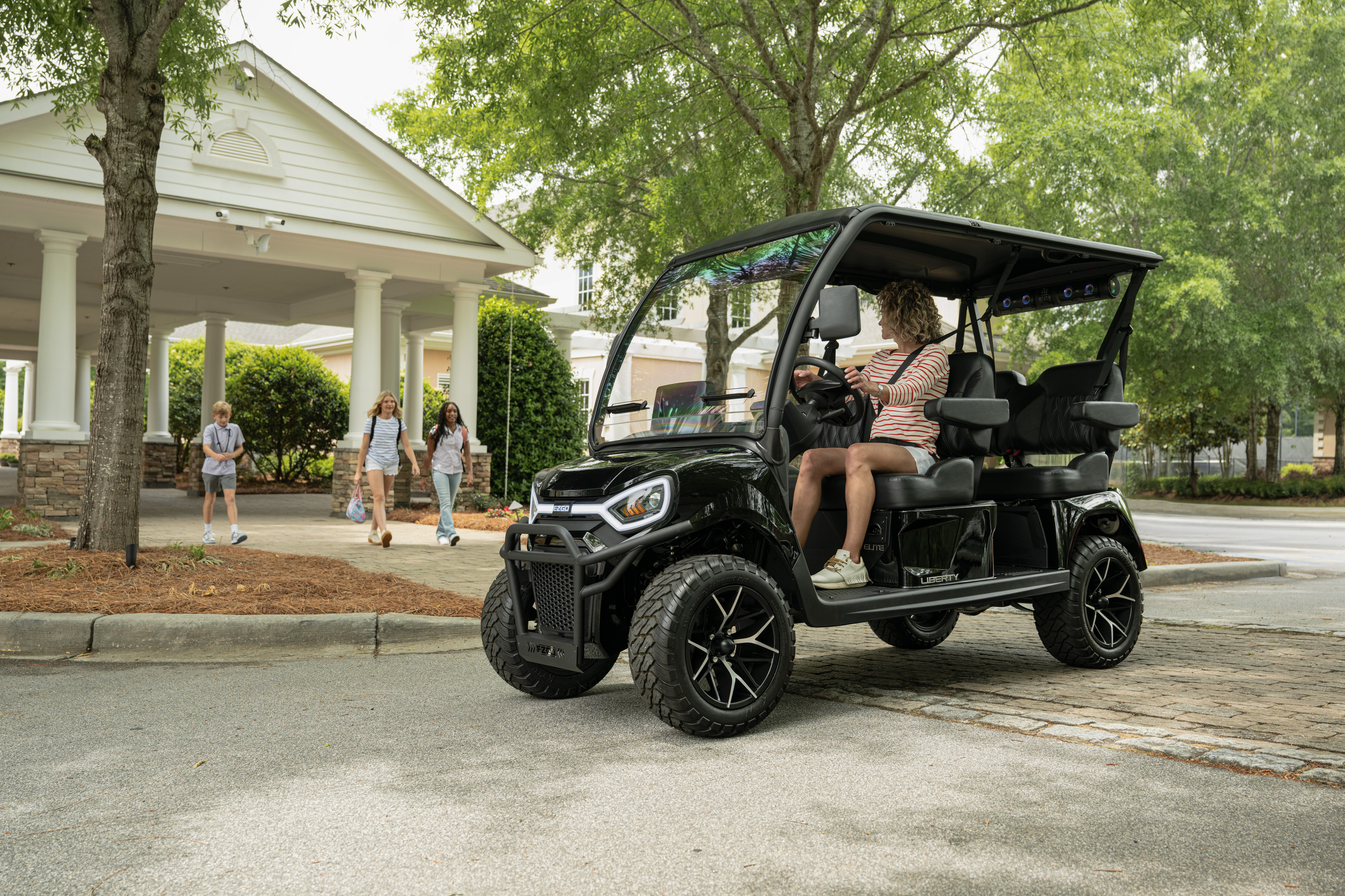 E-Z-GO Liberty 4F, an electric four forward-facing seat golf cart.