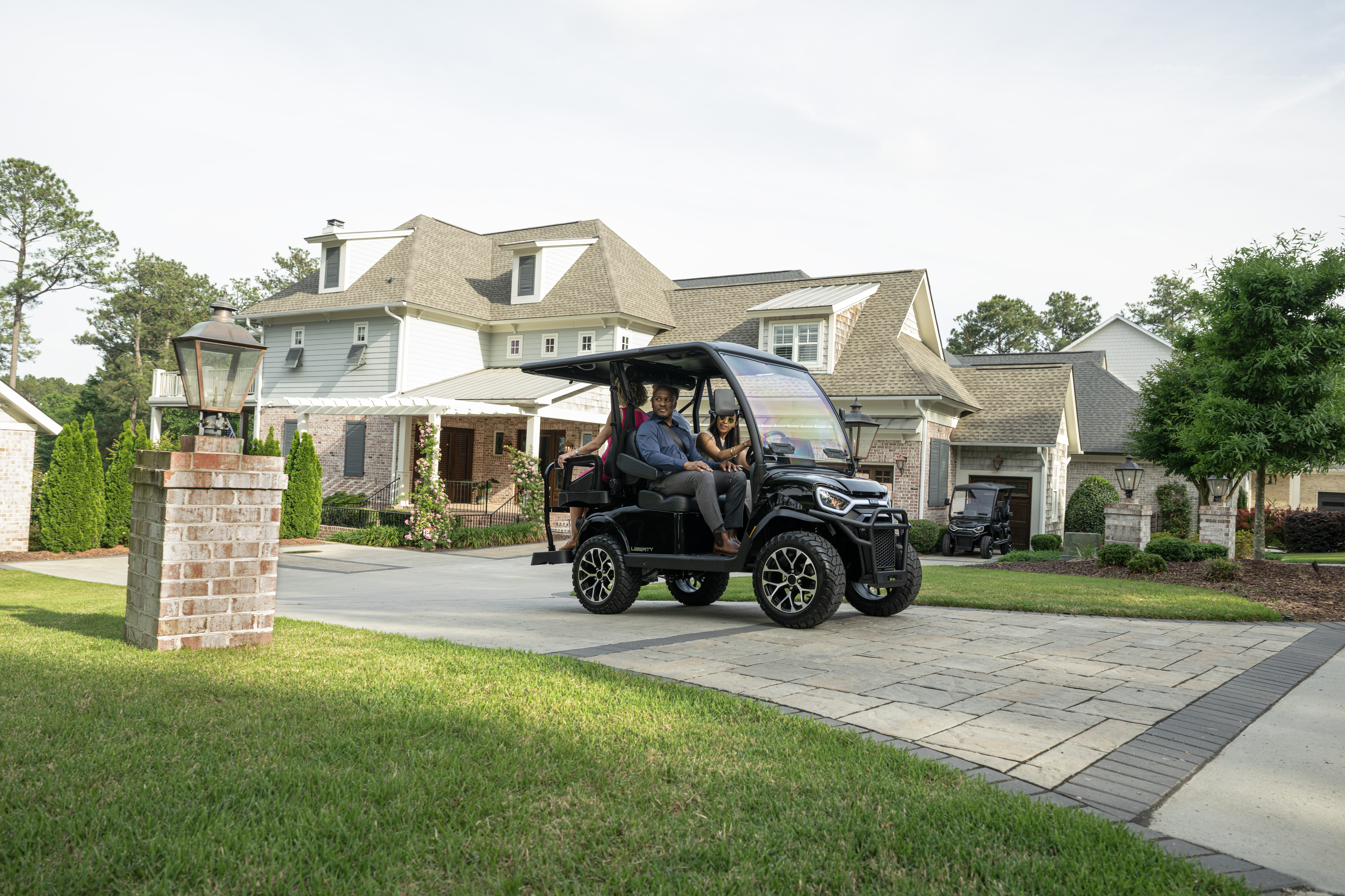 The E-Z-GO Liberty 4 is a four-passenger golf or electric golf cart with two-forward and two-rear facing seats