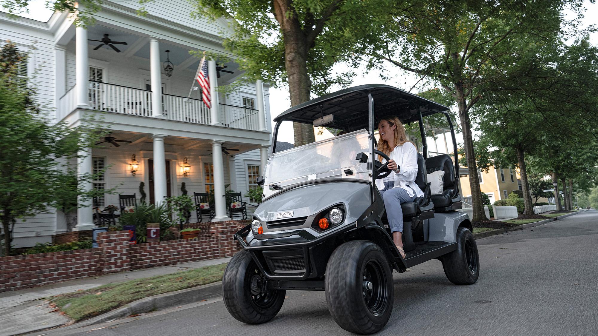 Liberty riding through a neighborhood